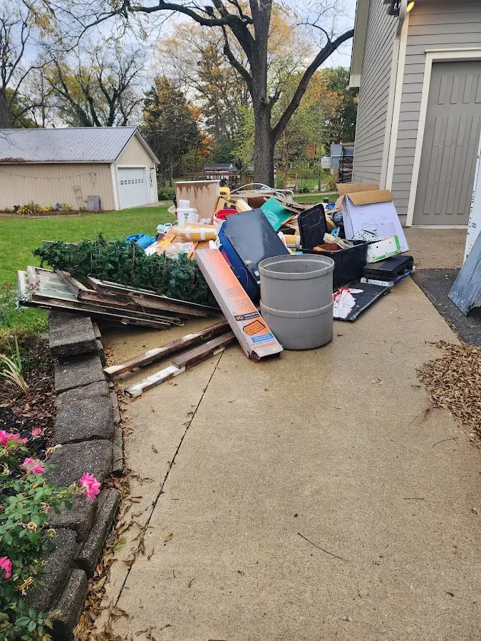 Dumpster being loaded with debris for 3 Yard Dumpster Rental in New Windsor